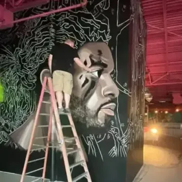 McClellan working on the mural at Flying Squirrel Trampoline Park:  Lutz Florida